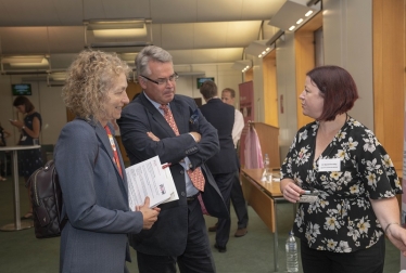 Tim Loughton MP gets behind the microscope at Breast Cancer Now research fair in Parliament